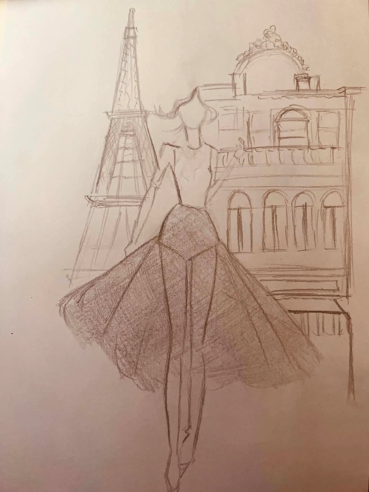 Pencil sketch of a gown with the Paris skyline behind it